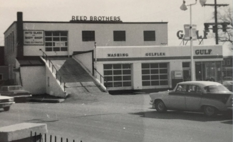 Circa 1968, the concrete ramp on the left leads up to the Auto Glass and Body Repair Shop